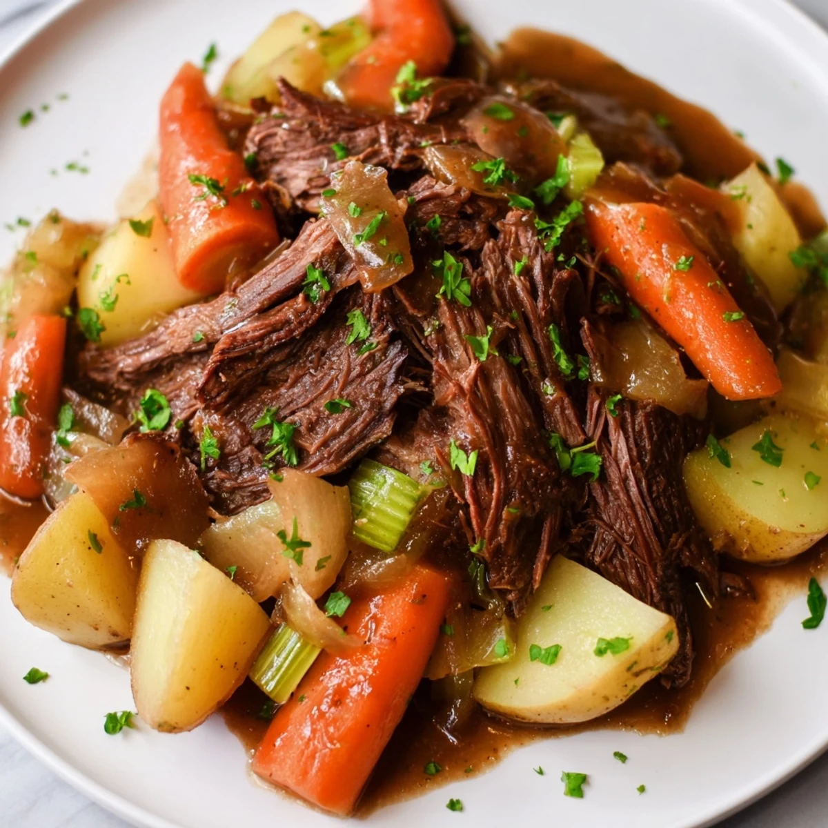 Savory Irish Beef Pot Roast with root vegetables steaming from a rich, dark broth, served family-style on a platter.