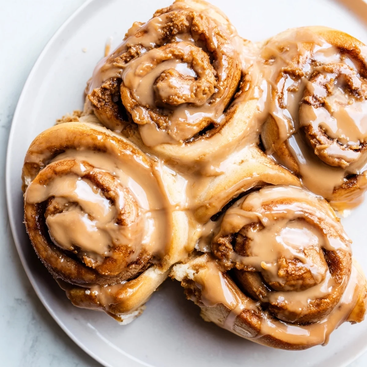 Warm Soft and Gooey Biscoff Cinnamon Rolls swirled with cookie butter filling, ready for a cozy American breakfast or brunch.