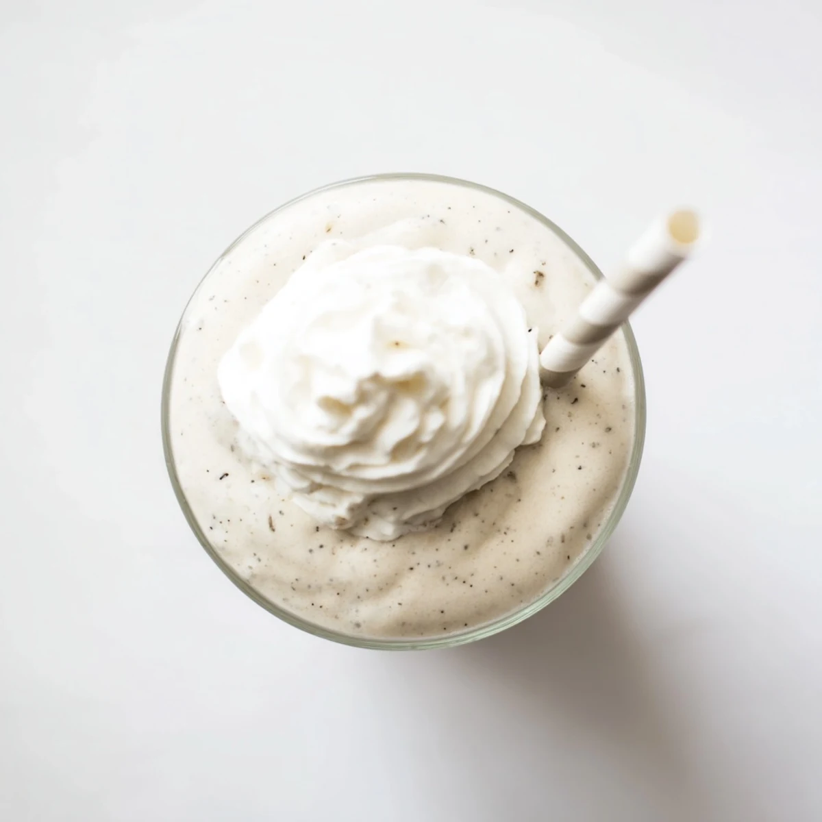A refreshing Vanilla Bean Frappuccino blended with ice, milk, and vanilla bean seeds for a frosty coffeehouse treat.