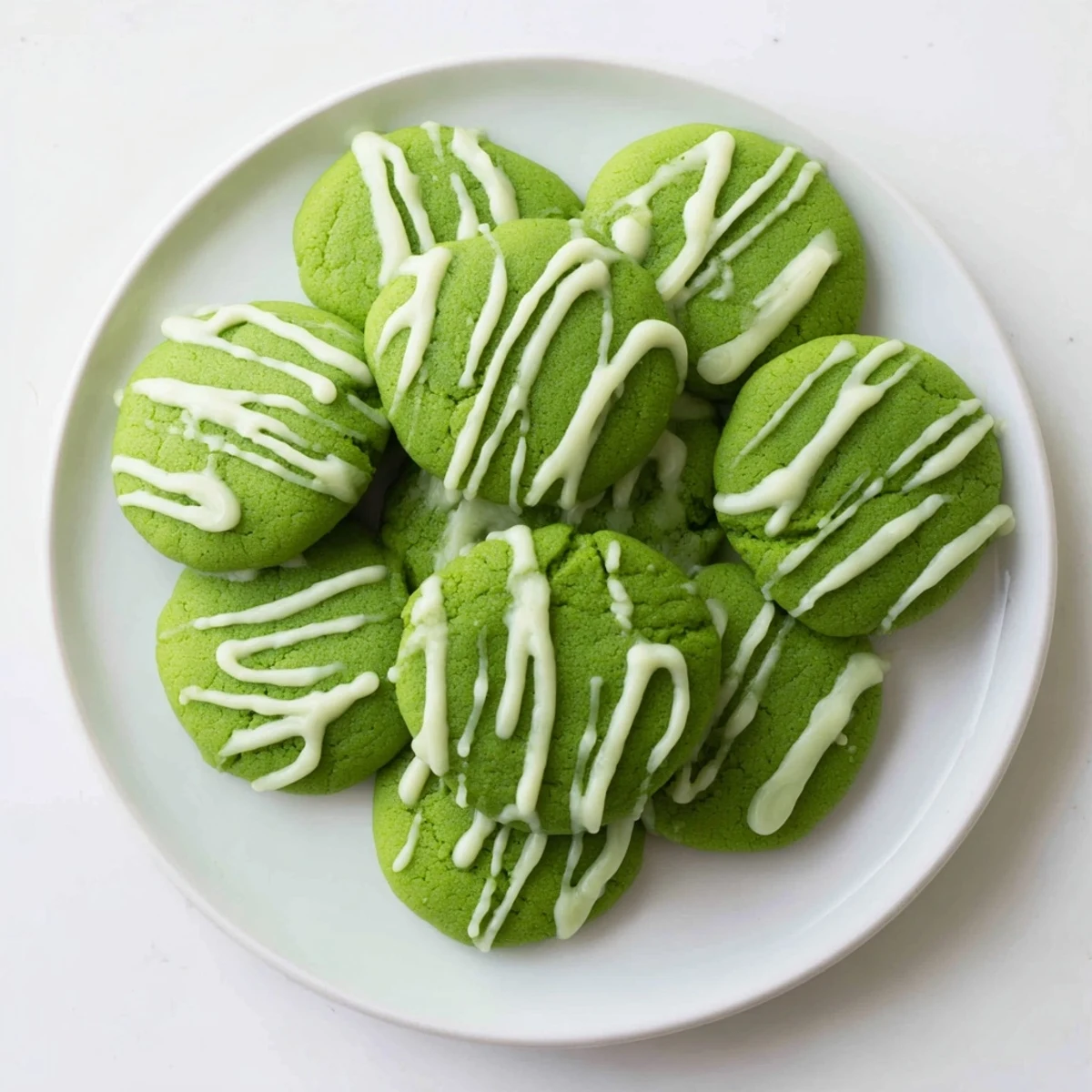 Holiday-style green velvet treats featuring smooth white chocolate glaze and chewy texture