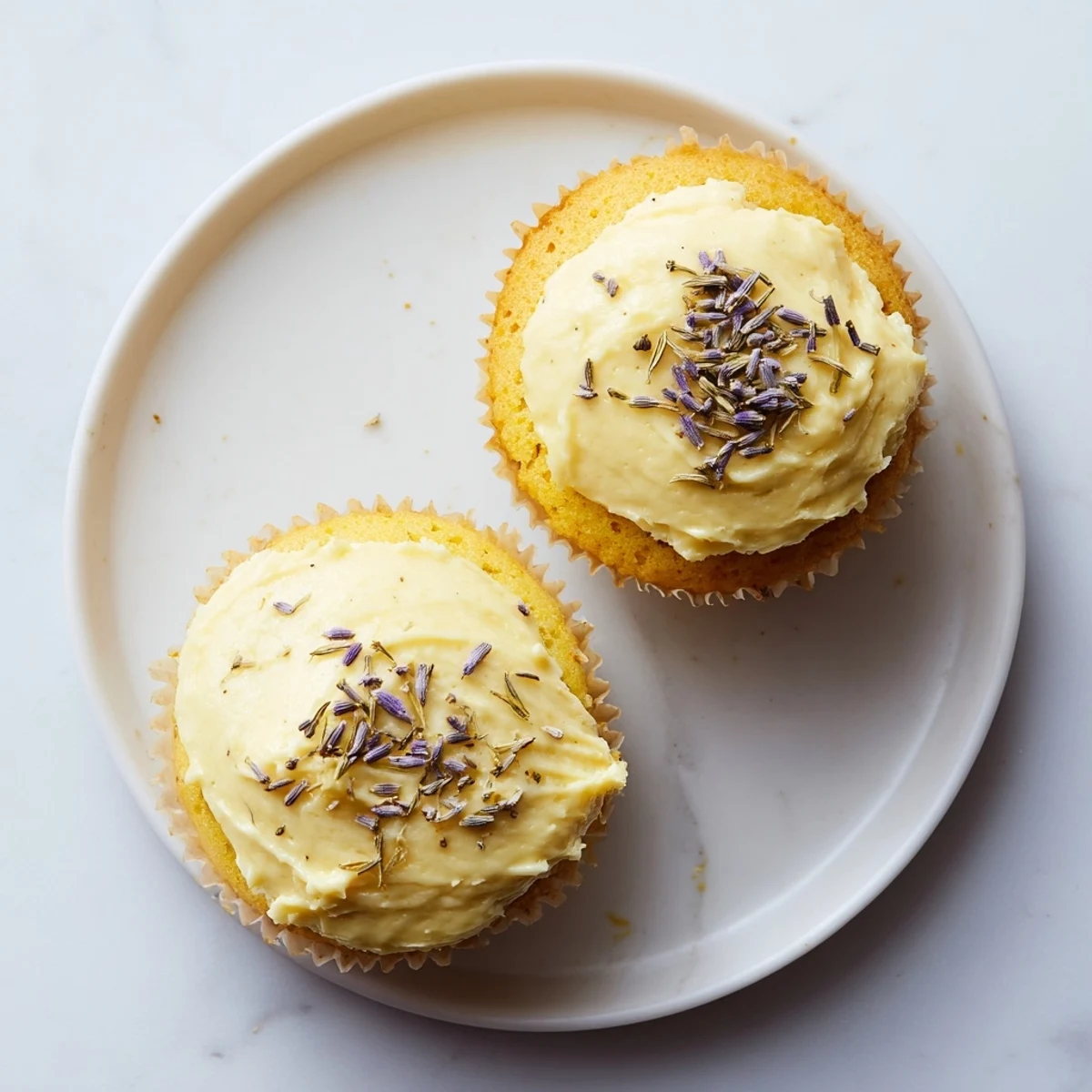 Spring dessert of lemon lavender cupcakes with light fluffy crumb and floral frosting decoration