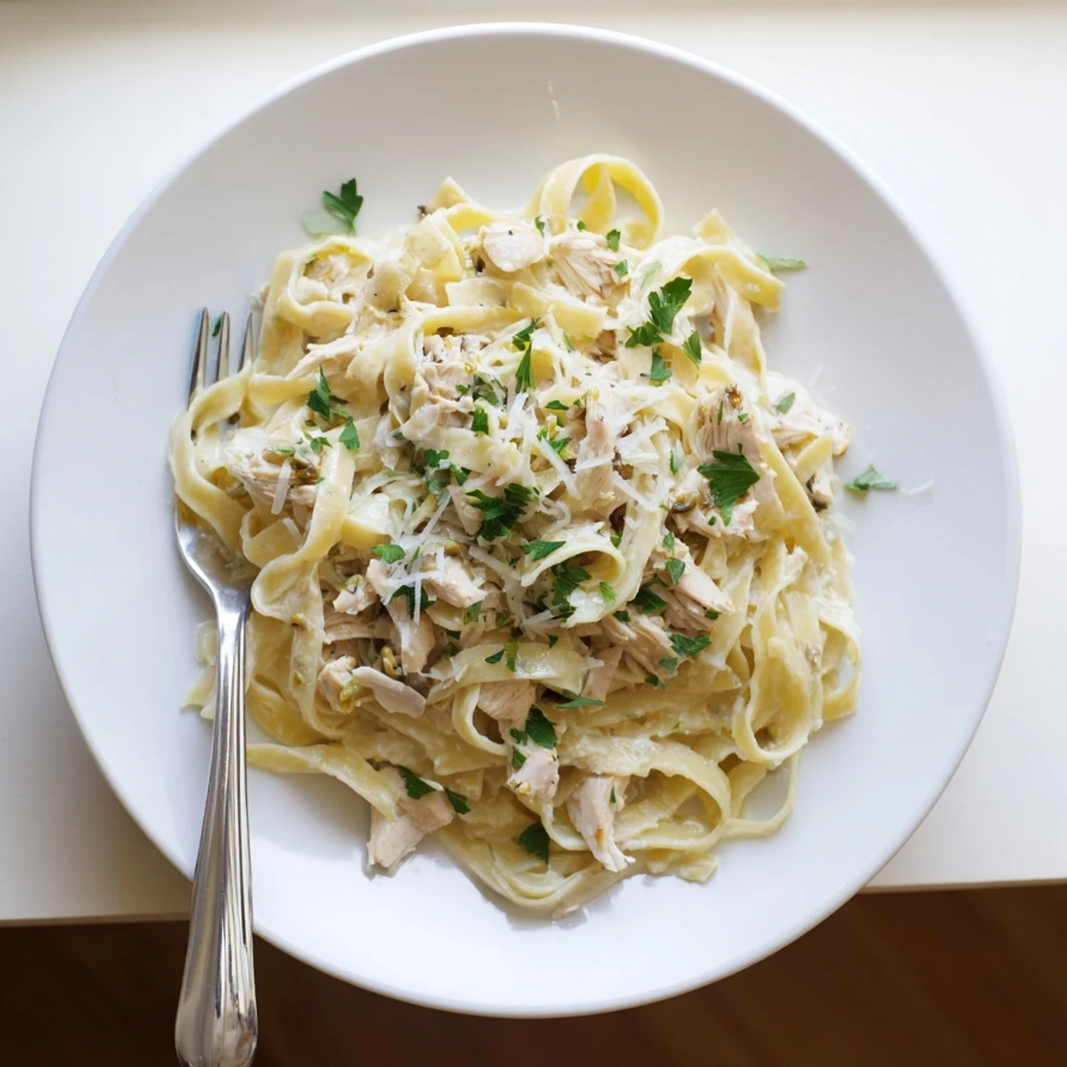 Comforting Crock Pot Chicken Alfredo recipe with fettuccine noodles in a velvety cream sauce