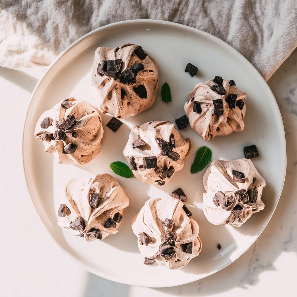 Close-up of dark chocolate and mint chip clouds showing crisp texture and mint chips