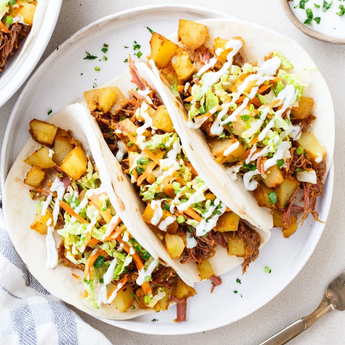 Warm flour tortillas filled with tender corned beef, crispy potatoes, and fresh cabbage slaw