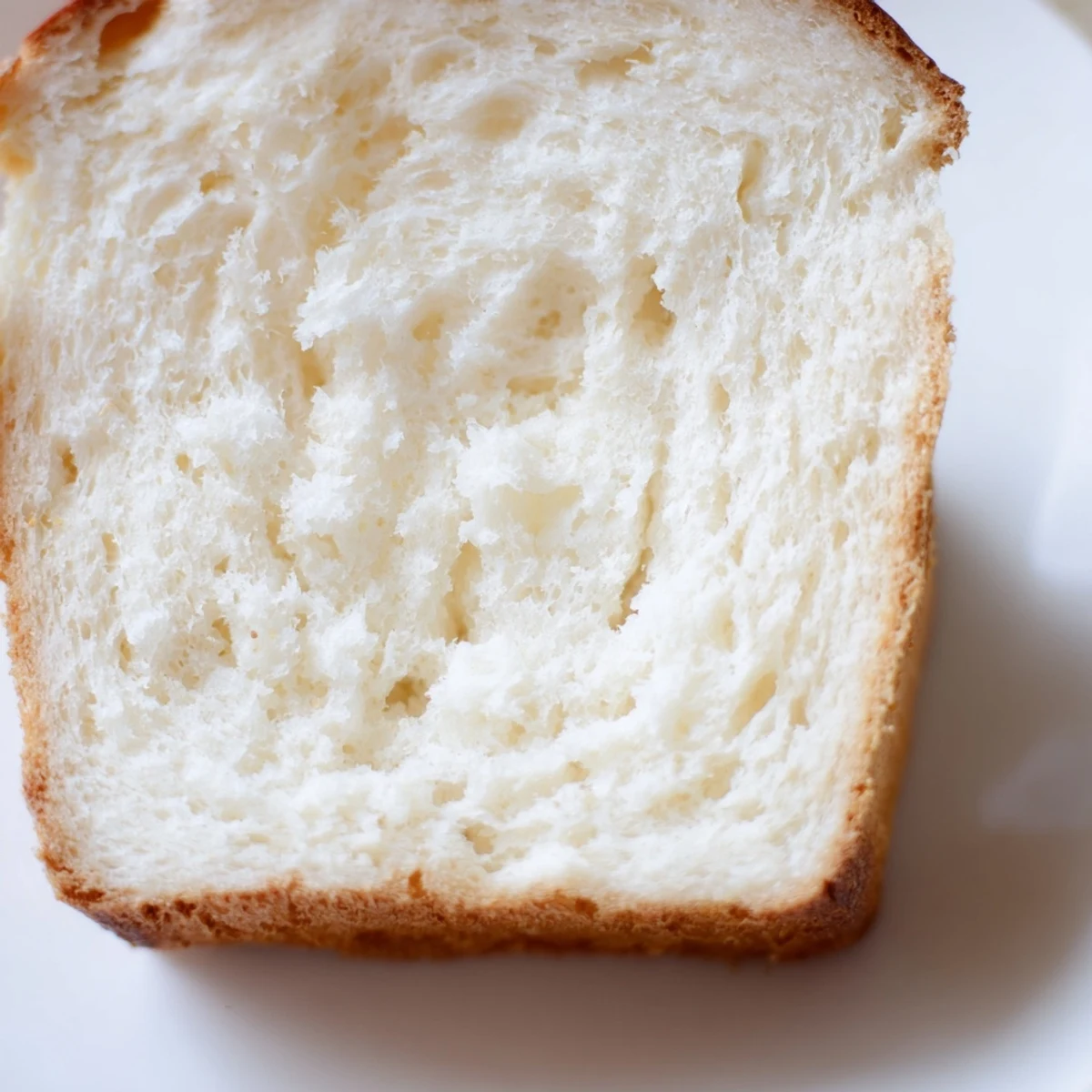 Homemade zero carb yogurt bread with golden crust, cut into thick slices ready for low carb sandwiches