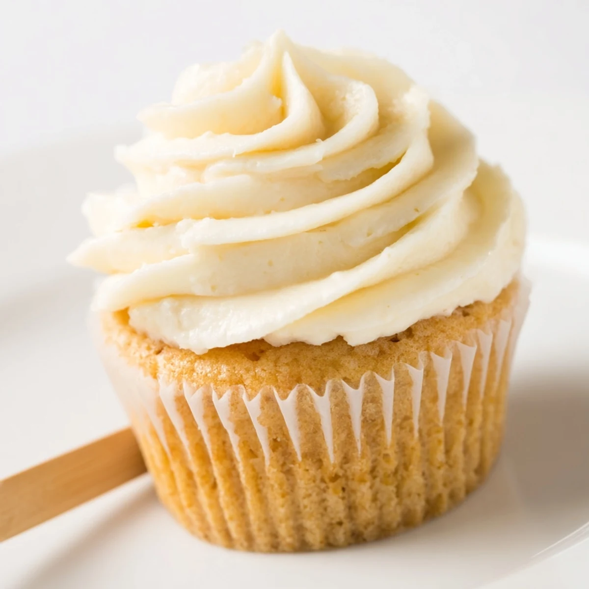 Light and fluffy homemade vanilla cupcakes with swirled vanilla buttercream and colorful sprinkles