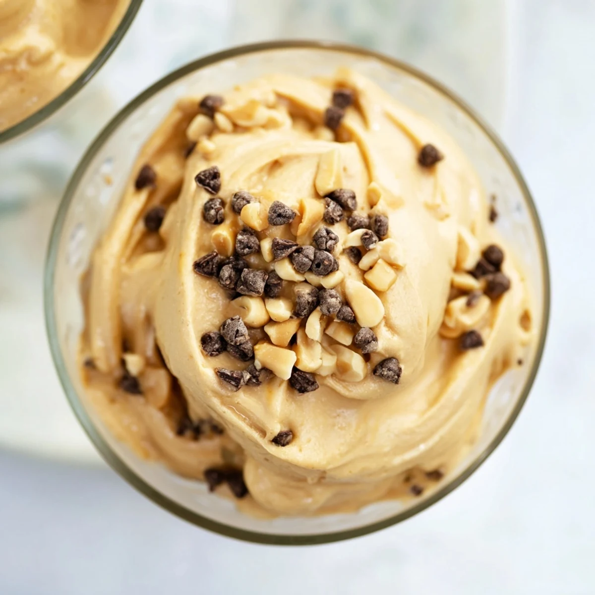 Light and fluffy peanut butter and Cool Whip mousse served chilled in individual dessert bowls