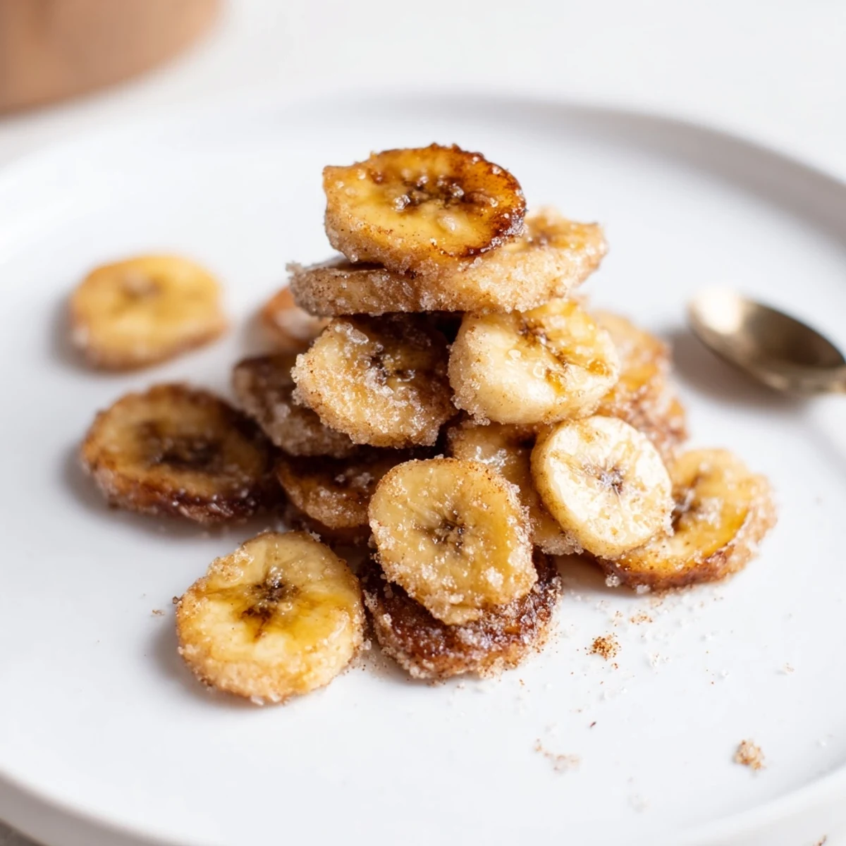 A bowl of Crispy Cinnamon Sugar Air Fryer Banana Chips, ready for snacking