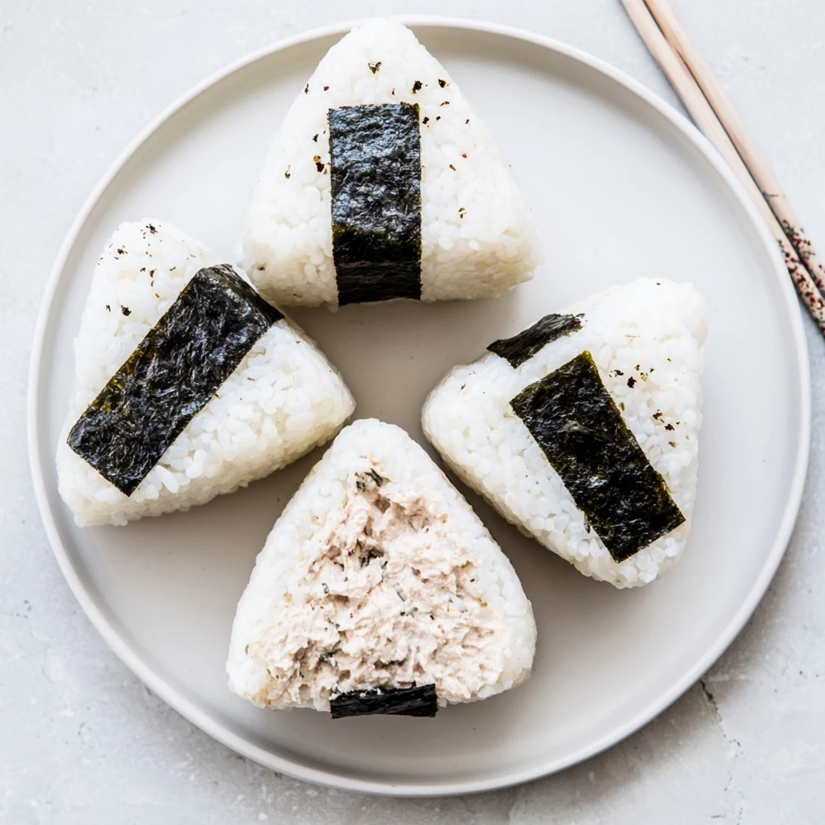Creamy tuna mayonnaise filled Japanese rice ball shaped into perfect handheld triangles