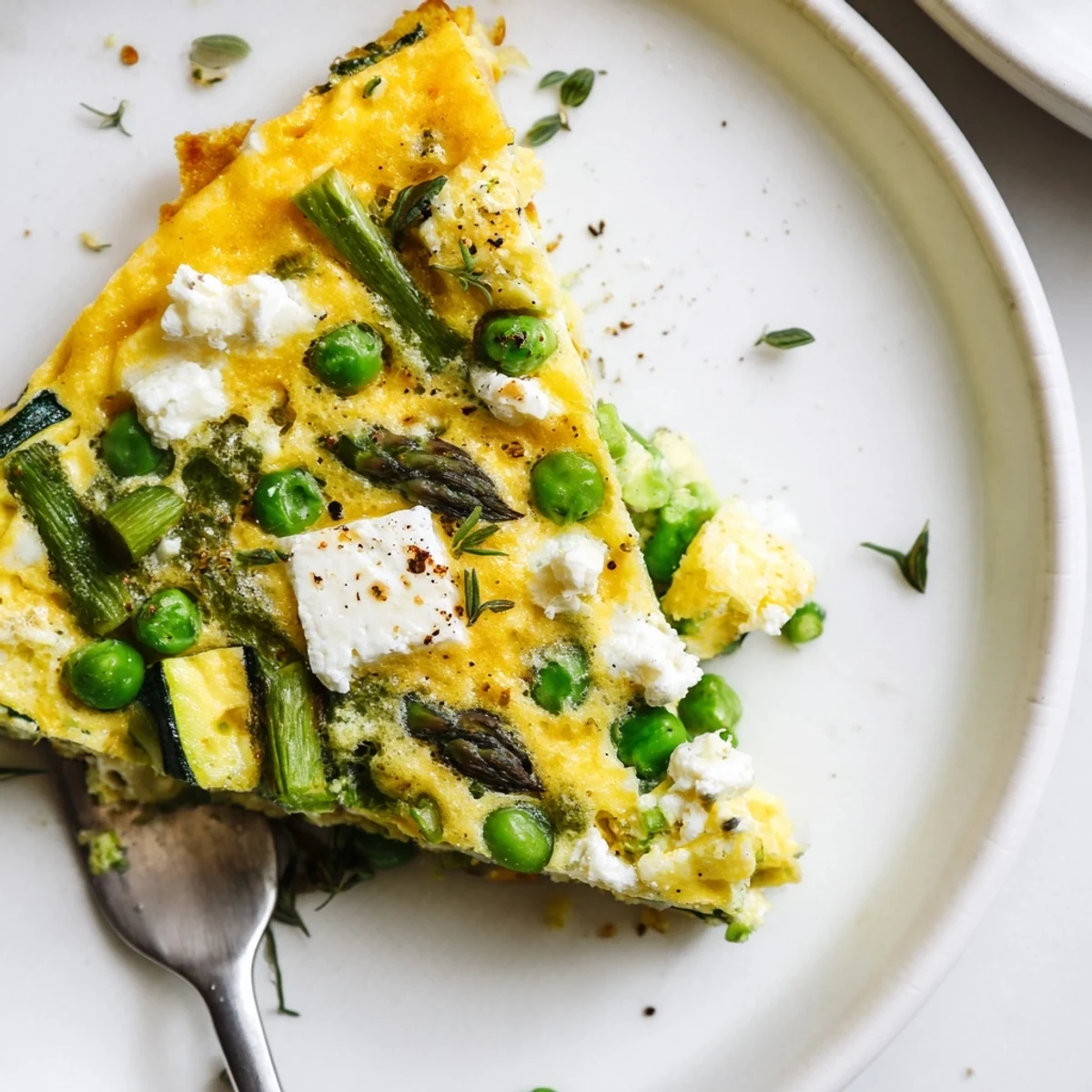 Bright Spring Vegetable Frittata With Goat Cheese, herb-scented, perfect brunch centerpiece